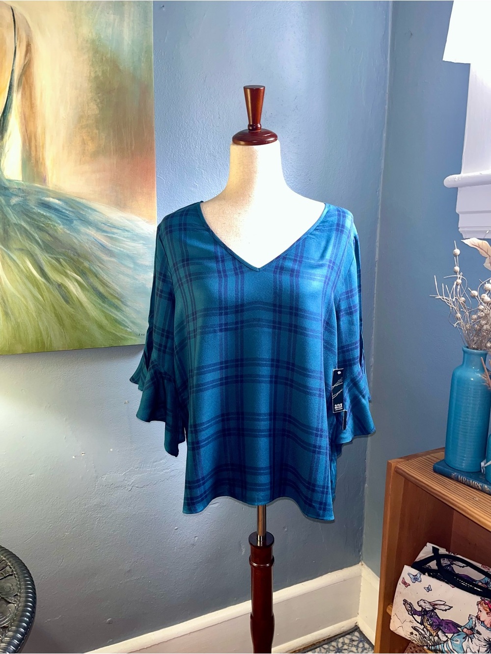 New with tags, a.n.a. top, size L, blue plaid, 3/4 length flutter sleeves.